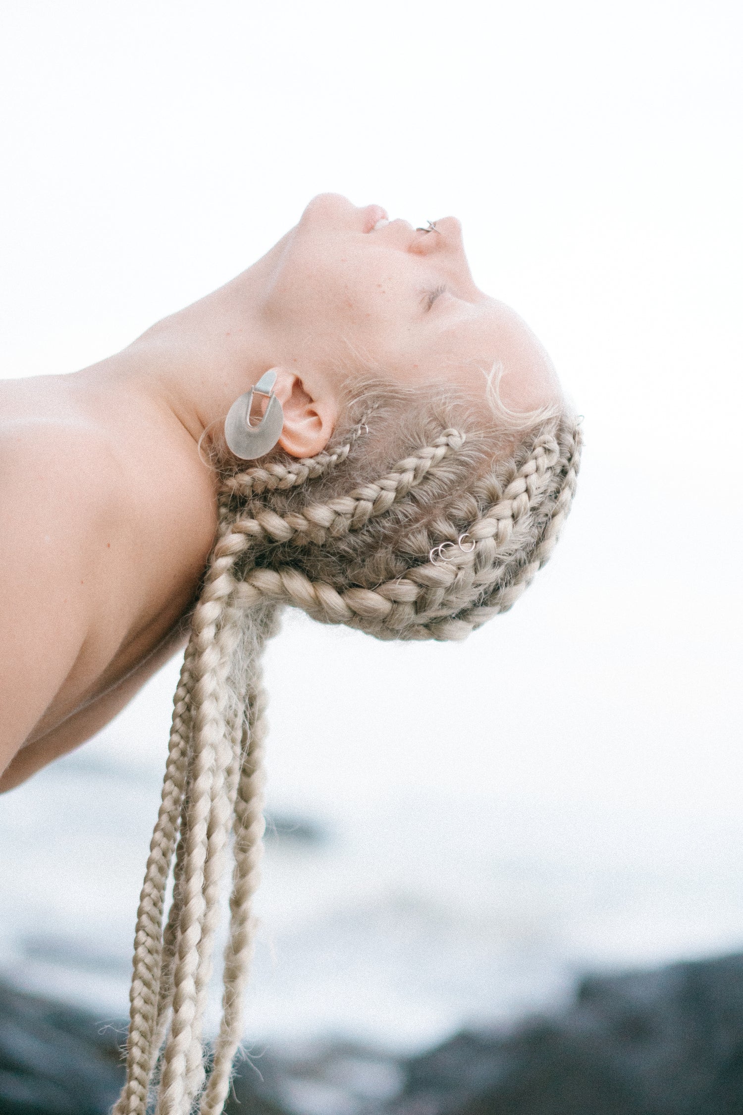 Beauty shot of Vasilisa wearing Elaktra Earrings Silver Medium