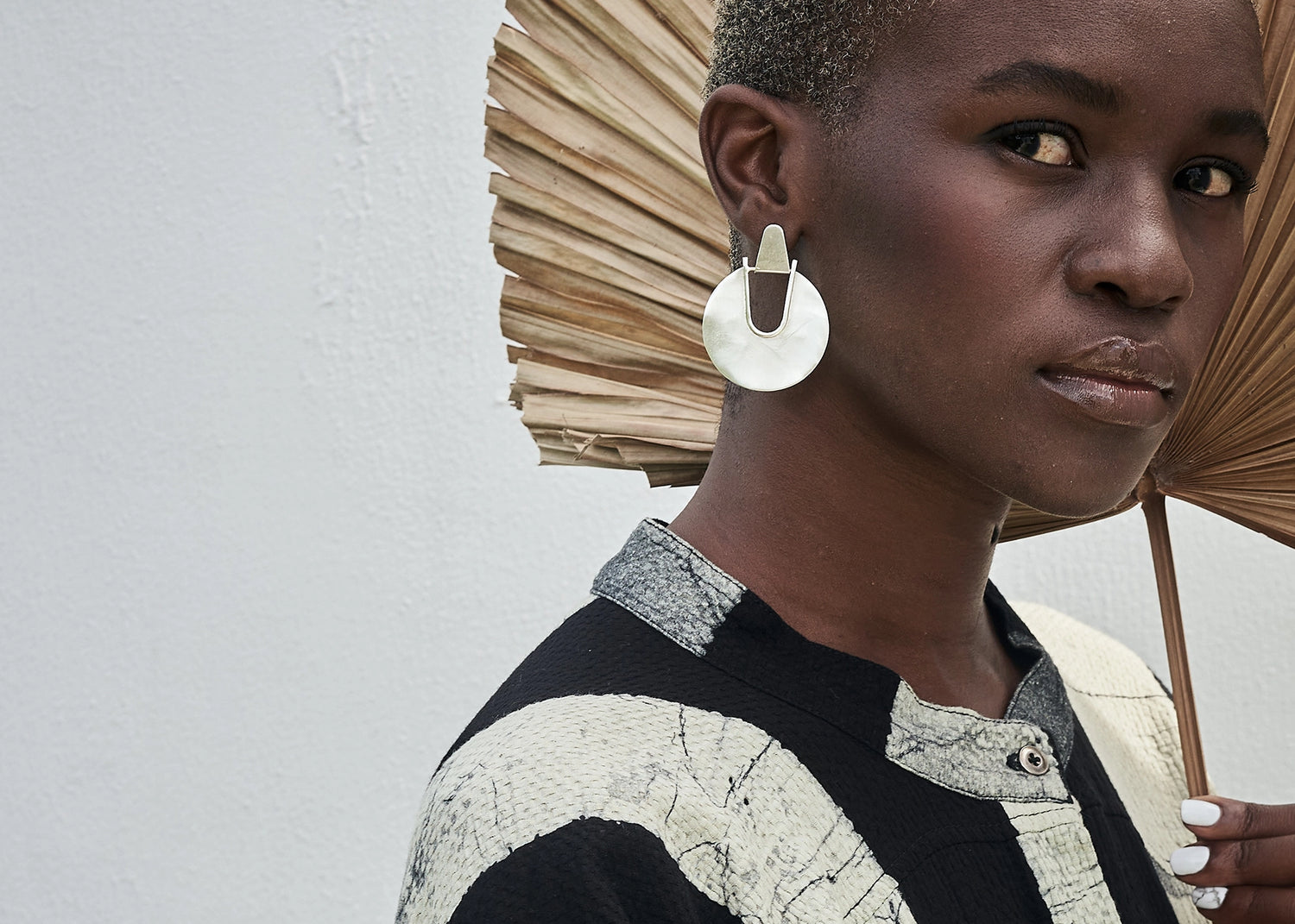Editorial shot of Thoko wearing Elektra Earrings Silver