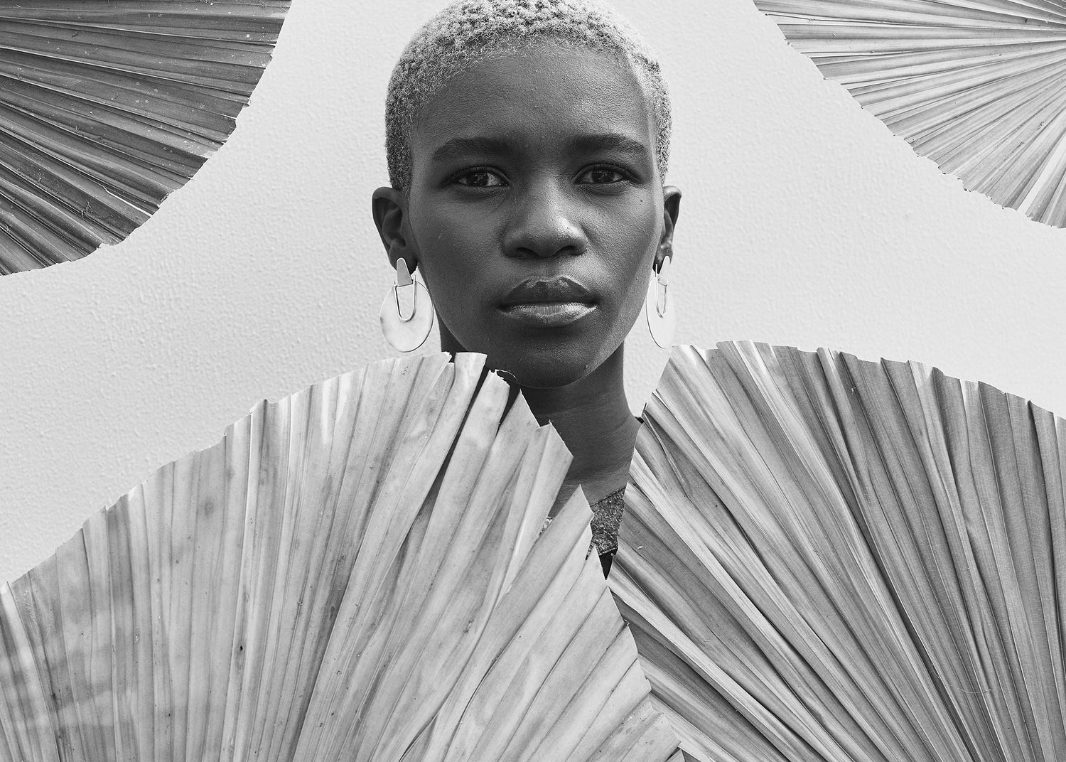 Editorial shot of Thoko wearing Elektra Earrings Brass Medium