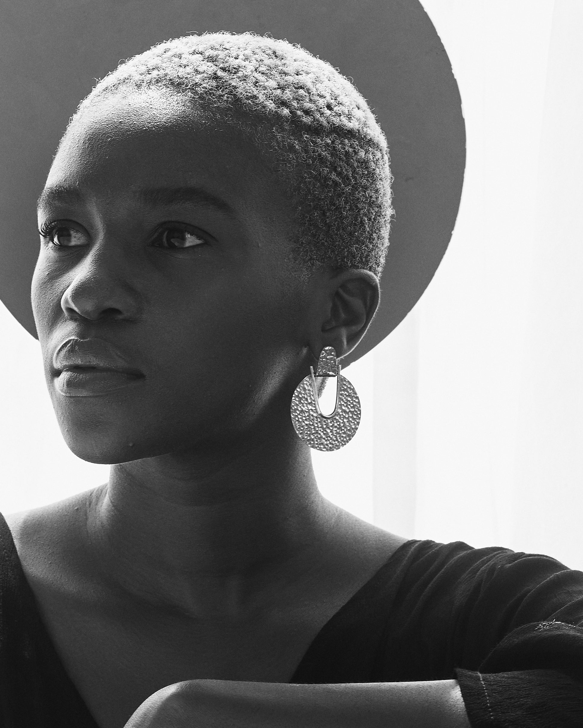 Beauty_shot_of_Thoko_wearing_Elektra_Earrings_Silver_Hammered_Medium
