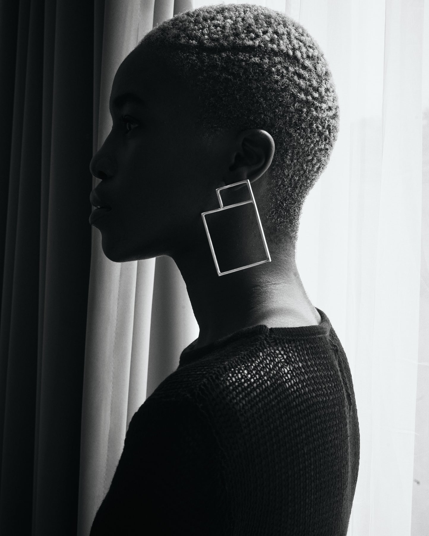 Editorial shot of Thoko wearing Square Space Earrings Silver